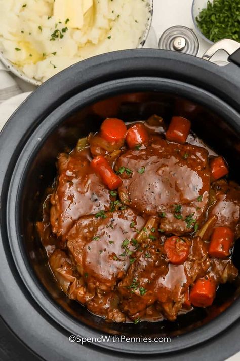 Swiss Steak made in the Crockpot is a rich & hearty meal that can feed a crowd. Steak & veggies are slow-coked with a flavorful sauce until tender! #spendwithpennies #crockpotswisssteak #recipe #maindish #entrèe #swisssteak #crockpot #slowcooker #gravy #best #easy Swisssteak Crockpot, Swiss Steaks, Crockpot Swiss Steak, Slow Cooker Steak Recipes, Swiss Steak Crockpot, Crockpot Steak Recipes, Swiss Steak Recipes, Slow Cooker Steak, Crockpot Steak