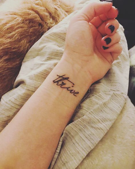 Thrive tattoo with vegan ink. 🌱  #vegan #tattoo #wristtattoo #thrive Thrive Tattoo, Enough Script Tattoo, The Thrive Approach, Thrive Le Vel 3 Steps, Thrive Le-vel, Red Ink, Wrist Tattoos, Print Tattoos, Paw Print Tattoo