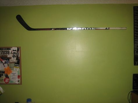 Mounting on the Wall Hockey Stick Furniture, Hockey Sweater, Diy Holder, Hockey Fans, Picture Hangers, Hockey Stick, Corrugated Cardboard, Painters Tape, Sports Photography