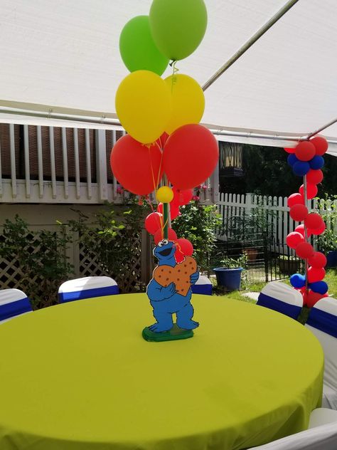 Luca Sesame Street 1st birthday party | CatchMyParty.com Sesame Street Centerpiece, Sesame Street Birthday Party Ideas Boy, Elmo Birthday Party Boy, Sesame Street Birthday Cakes, Sesame Street Birthday Party Ideas, Cookie Monster Birthday Party, Cookie Monster Birthday, Elmo Birthday Party, Backyard Birthday