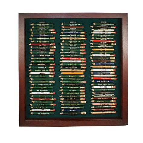 "Just because you got them for free doesn't mean that your golf pencil collection isn't important. With space for 96 pencils, this handsome frame lets you memorialize your golfing history in a simple, elegant way. Comes with a  98% UV blocking acrylic cover that will protect your golf pencil collection from harmful sunlight, dust, and curious onlookers alike. Holds round and octagonal pencils and is available in cherry, black, walnut, and oak finishes. Dimensions: 15.5W x 16.5\"H" Golf House Ideas, Golf Pencil Display, Pencil Display, Golf Theme Office, Vintage Golf Decor, Golf Bedroom, Golf Nursery, Golf Ball Display Case, Golf Room