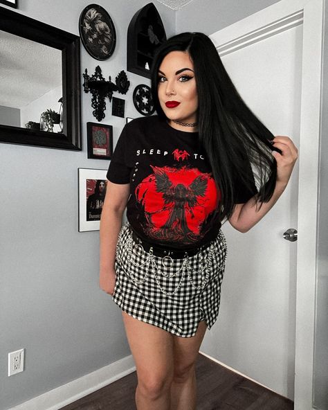 I wish I could go back in time and experience Sleep Token live again for the first time. 🥹🖤 What concerts are you looking forward to? I’m going to see Dayseeker in October and they’ve been on my bucket list for a while now! Outfit Details Sleep Token Band Shirt: @hottopic Loop Chain Waistbelt: @sheincurve Buffalo Plaid Skort: @sheincurve Code: NikkiQ215 for 15% off Shein #hottopic #htfanatic #sleeptoken #alternativefashion #htfandom Sleep Token Band, Plus Size Alternative Outfits, Plus Size Concert Outfit, Plus Size Alternative, Band Tee Outfits, Haunting Adeline, Red Angel, Plaid Skort, Concert Fit