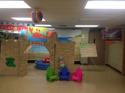 We created an indoor sandcastle playground, with a crabby treasure digging table & brick sized sand colored cardboard building blocks to stimulate the kids imaginations & keep them entertained constructively moving between classes if there was a slow down! Diy Sandcastle Cardboard, Sandcastle Decoration, Cardboard Sandcastle, Cardboard Building Blocks, Lifeway Vbs, Castle Backdrop, Study Decor, Beach Table, Castle Decor