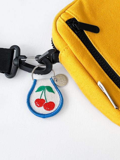 Show your keys some love with a Three Potato Four patch keychain! Retro Cherries inspired. Embroidered natural cotton patch keychain with double-sided embroidery and a metal split keyring. 2.5" x 1.8" Patch Keychain, Retro Keychain, Keychain Designs, Four Patch, Holiday Stocking, Keychain Design, Great Christmas Gifts, Stocking Stuffer, Retro Inspired