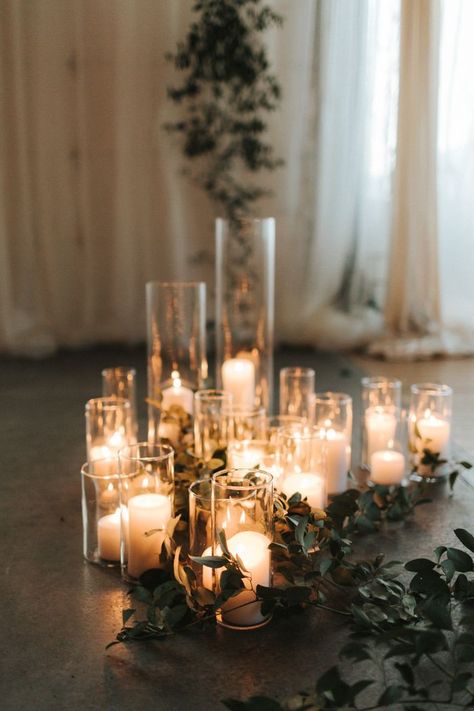 Simple white candles in glass vases added a warm touch to this indoor ceremony | Image by Gallivan Photo Nye Wedding Decor, White Candles Wedding, Wedding Candles Table, Wedding Ceremony Ideas, Nye Wedding, Candle Wedding Decor, Indoor Ceremony, Wedding Ceremony Decorations, Indoor Wedding