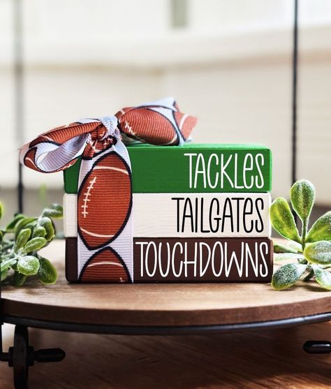 Are you looking for the perfect football tiered tray decor or football decor? Our football mini wood book stack is perfect on its own or displayed together with other fall sports tiered tray decor, football party or game day decorations. Welcome football season with our other matching items. Take a peek in our shop SWEETBEANFARMHOUSE , there is now over 1000 items to choose from.  https://www.etsy.com/shop/SweetBeanFarmhouse ❤ SIZE: WE ARE NOT RESPONSIBLE FOR FAILURE TO READ DIMENSIONS OR PROCES Football Season Decor Diy, Football Wood Crafts, Fall And Football Decor, Football Display Ideas, Football Season Decor, Bookstack Decor, Diy Football Decor, Football Tiered Tray, Football Wreaths