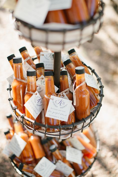 For a homespun twist on hot sauce wedding favors, we love how this bottle put the rich orange color of the sauce on display. A monogrammed label was the perfect finishing touch. Hot Sauce Wedding, Hot Sauce Wedding Favors, Food Wedding Favors, Summer Wedding Reception, Creative Wedding Favors, Inexpensive Wedding Favors, Edible Favors, Wedding Favors And Gifts, Favors Ideas