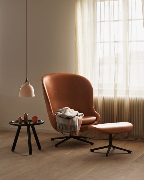 Bring calmness and coziness into your home by dedicating a corner for relaxation and breaks from daily tasks and busyness. Hyg is an exclusive lounge chair in which soft lines and encircling contours create a cozy and pleasant space. #normanncopenhagen #hyg Design Online Shop, Practical Lighting, Swivel Office Chair, Wood Bar Stools, Normann Copenhagen, Bell Pendant, Lounge Seating, House Doctor, Eames Lounge Chair