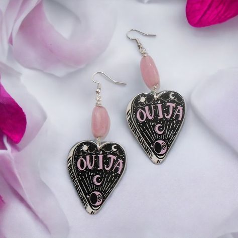 https://www.etsy.com/listing/1283098734/divination-magic-pastel-goth-jewelry 🔮✨ Discover the allure of the mystical with our Ouija Planchette Pastel Goth Earrings! 💀🎀 These occult earrings for women feature delicate pink acrylic beads, ideal for those embracing their pagan or Wiccan beliefs. 🌸✨ Infuse your style with a blend of gothic and kawaii charm with these symbolic jewelry pieces. 🖤🔮 Perfect for gifting or adorning your own ears with a touch of magic! 🎁✨ CLICK LINK IN BIO to add them t... Occult Earrings, Pastel Goth Earrings, Divination Magic, Wiccan Beliefs, Ouija Planchette, Goth Earrings, Goth Jewelry, Symbolic Jewelry, Pink Acrylic