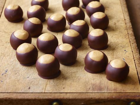 Buckeyes Recipe : Food Network Kitchen : Food Network - FoodNetwork.com Buckeyes Recipe, Peanut Butter Truffles, Holiday Baking Recipes, Best Christmas Cookies, Köstliche Desserts, Sweets Treats, Holiday Baking, Holiday Cookies, Candy Recipes