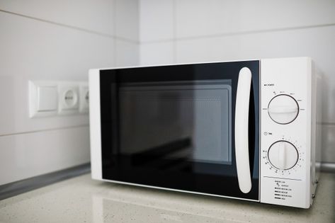 Modern kitchen interior with microwave o... | Premium Photo #Freepik #photo #technology #hand #button #kitchen Microwave Aesthetic, Cream Colored Kitchens, White Kitchen Interior, Micro Oven, Fast Food Workers, White Microwave, Modern Black Kitchen, Wood Floor Kitchen, Plastic Food Containers