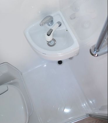 Small RV Trailers bathroom - I don't understand why they would bother putting in a vanity, if it's so small that you can't even get your hands under the tap? Small Rv Trailers, Camper Bathroom, Portable Sink, Rv Interior Remodel, Add A Bathroom, Diy Campervan, Rv Bathroom, Small Rv, Tiny Camper