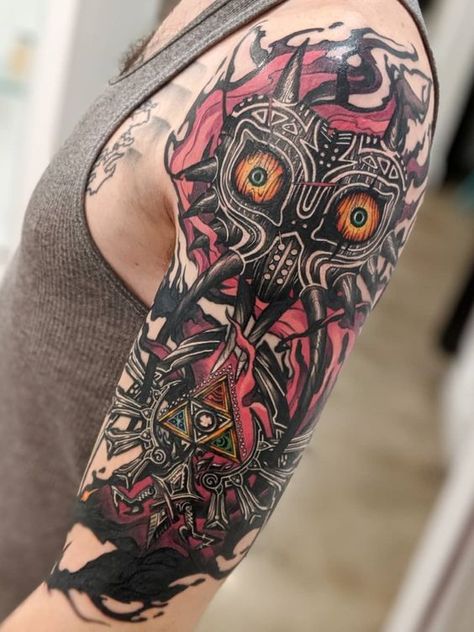 Zelda Art Tattoo, Floral Zelda Tattoo, Sifi Tattoos, The Legend Of Zelda Tattoo Ideas, Legend Of Zelda Tattoo Ideas, Video Games Tattoo, Gaming Tattoo Ideas, Majoras Mask Tattoo, Zelda Tattoo Ideas