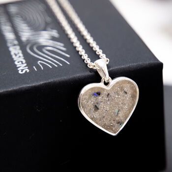 Continuing our memorial collection is this stunning heart-shaped memorial ashes necklace.A symbol of love, compassion and remembrance, this piece is a perfect way to hold a memory of a loved one close to your heart.
Crafted in hallmarked sterling silver, your ashes are then held securely in place with ultra-strong clear epoxy resin.
For a unique touch, we can incorporate nacre, the iridescent part of shells hand-collected near our Brighton studio. Each shell is one-of-a-kind, just like your loved one, making every memorial piece truly special.
If you have any further personal requests, contact us, and we'll discuss what's possible.
Once you place an order, we will contact you immediately to explain the next steps and how to send your ashes to us.This product is made from sterling silver an Memory Of A Loved One, Ashes Necklace, Clear Epoxy Resin, Urn Necklace, Pet Ashes, Pendant Heart, Urn Necklaces, Clear Epoxy, Memorial Necklace