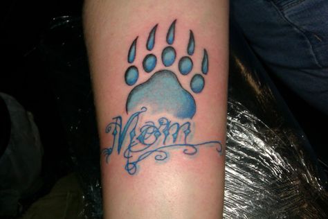 #mom #bear #paw #blue #script #tattoo #studio13tattoomg Mama Bear Paw Tattoo, Bear Paw Hand Tattoo, Bear Paw Tattoos Native American, Bear Paw Tattoo Design, Small Bear Paw Tattoo, Bear Paw Tattoo, Paw Tattoo Ideas, Heaven Tattoo, Bear Paw Tattoos