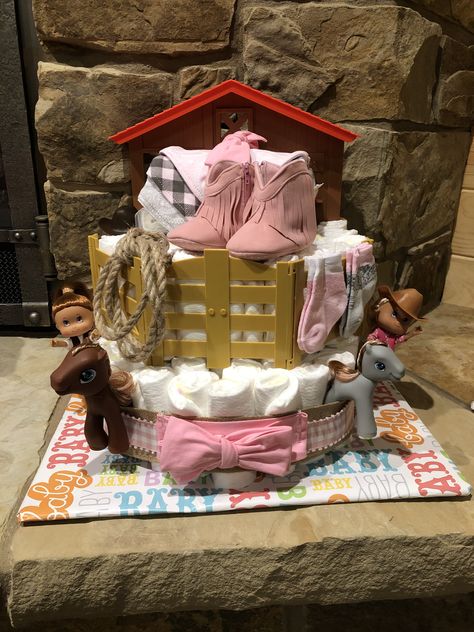 Western themed baby girl cowgirl diaper cake Cowgirl Diaper Cake, Western Theme Baby Shower Ideas Girl, Western Diaper Cake, Cowgirl Theme Baby Shower Ideas, Western Baby Shower Ideas Girl, Cowgirl Baby Shower, Cowgirl Baby Shower Ideas, Cowgirl Baby Shower Theme, Cowboy Baby Shower Theme