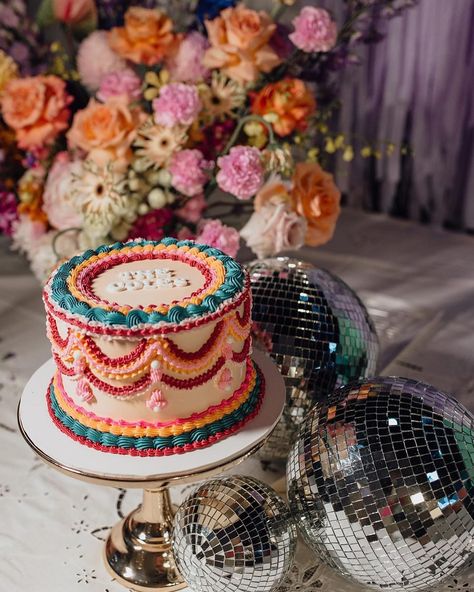 This colourway 👌🏼 @wolfandwildflowerphotography @wolfandthewildflowers_ @rundletailoring @hellofleur_ @confettipartyhire @eventstoadore @emmah.jane.made #vintagevibes #vintagestyle #bespokecake #spodeli #vintagecakesnewcastle #spodelinewcastle #vintagecake #retro #retrocake #vintageweddingcake #lambethcake #heartcake #heartshapedcake #vintageheartcake #roccoco #newcastle #vintageweddingcake #whiteonwhite #renaissance #cakepiping #cakedecorating Retro Themed Cake, Colorful Vintage Cake, Primary Color Cake, Retro Cake Design, Retro Wedding Cake, Beatles Cake, Retro Wedding Cakes, Disco Cake, Retro Cake