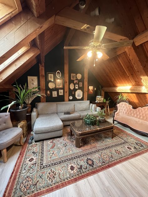 this log home cabin in upstate NY has a new dark green wall and vintage decor, everything thrifted except the rug, its from target! Cabin Green Interior, Hunters Cabin Interior, Dark Green Cabin, Moody Attic, Mountain Cottage Interiors, Cabin Homes Interior, Hunters Cabin, Cabin Build, Green Bedroom Walls