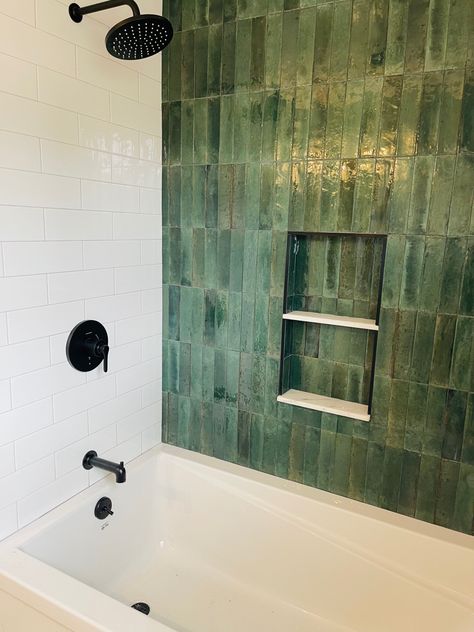 The Remedy tile collection by DALTILE. The shade HERBAL is absolutely stunning! Paired with large white subway tiles, marble shelves and matte black fixtures. Green Tile Shower With Bench, Green Tile Bathroom Black Fixtures, Tub With Surround And Tile, Green Subway Tile Bathroom Tub, Tile Shower Bathtub, Tiles Tub Shower Combo, Daltile Remedy Tile, Shower Remodel Green Tile, Green And Black Shower Tile