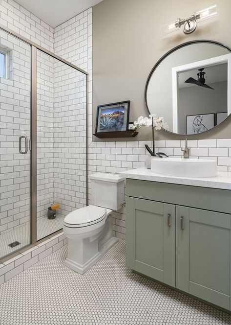 We love this clean and simple bathroom design with subway tile and geometric flooring! Subway Tile Bathroom Vanity, Tile Bathroom Vanity, Green Cabinets Bathroom, Bathroom Remodel Diy, Subway Tile Bathroom, Charming Bathroom, Green Bathroom Vanity, Simple Bathroom Designs, Subway Tiles Bathroom