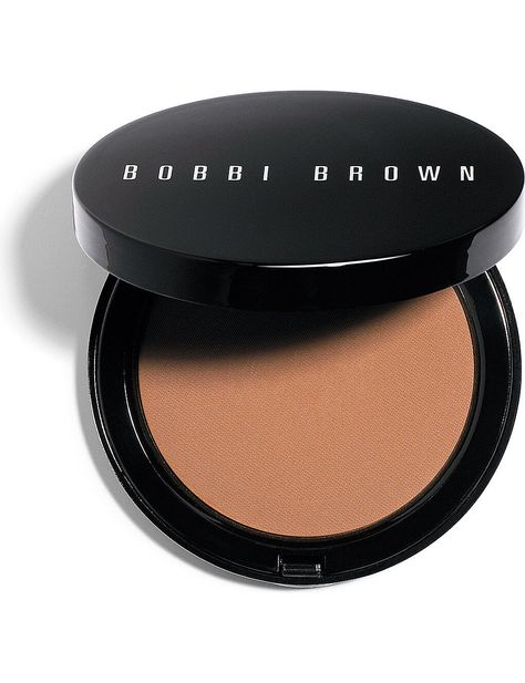 Bobbi Brown Bronzing Powder A silky smooth powder adds a healthy, sun kissed glow to any complexion instantly gives your skin the look of a natural tan. Bobbi Brown suggests using Bronzing Powder year round to get that healthy glow. Choose the shade that works best for your skin tone. Using the bronzer brush, sweep bronzing powder on the apples of the cheeks, forehead, nose and chin where the sun naturally hits the face. Finish with a light application of bronzing powder on the neck. Please use Bronzer Brush, Bronzing Powder, Natural Tan, Healthy Glow, Sun Kissed, Bronzer, Light Beige, Bobbi Brown, Dark Black