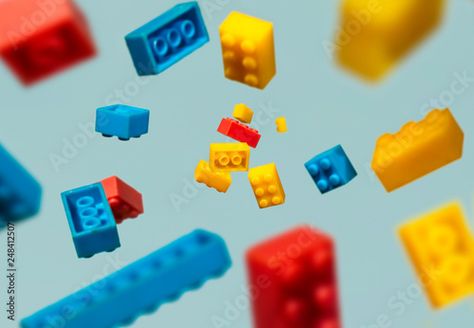 Stock Image: Floating Plastic geometric cubes in the air. Construction toys on geometric shapes falling down in motion. Brick Rendering, Coffee Table Photo Album, Coffee Theme Kitchen, Lego Poster, Lego Books, Flip Image, Picture Shelves, Patent Drawing, Canva Tutorial