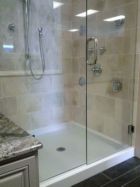 Here at Home Time Bathrooms, we offer a wide variety of materials to use in your bathroom remodel. Such as Tile, Acrylic, and Onyx. You can even combine materials to make your perfect shower, like this shower with a hinged glass door, ceramic tile walls, and an onyx shower pan base! Just call us to get a FREE Estimate! (480)-704-3327 Onyx Showers, Tile Shower Walls, Gorgeous Bathroom Tile, Onyx Shower, Shower Makeover, White Bathrooms, Tile Walls, Box House, Dream Bath