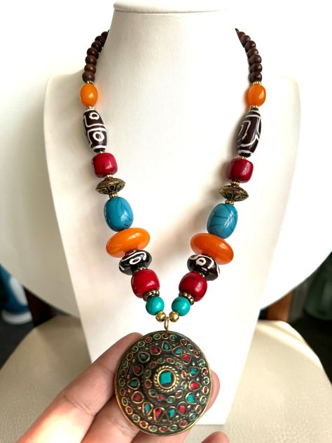 This beautiful and vintage Tibetan style handmade necklace with pendent inlaid with Coral and turquoise and made from Amber resin and yak bone  with Tibetan silver. This beautiful necklace is 23"inches long and weighs around 108 grams made in Nepal by skilled artisan. Great piece to add your jewelry collection from Asia.Thanks Hippy Jewelry, Tibetan Necklace, Amber Resin, Tibetan Jewelry, Necklace Beads, Brass Beads, Hippie Jewelry, Wedding Jewellery Necklace, Resin Beads