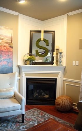 Thrifty Decor Chick corner fireplace makeover- Like the simplicity of mouldings for a straight wall fp as well. Corner Mantle, Corner Fireplace Mantels, Corner Fireplace Makeover, Corner Fireplace Decor, Awkward Corner, Design Camino, Fireplace Redo, Thrifty Decor Chick, Moody Bedroom