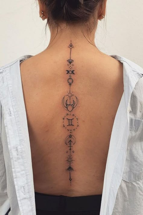 Looking for Gemini tattoo ideas for women and men?! If you want unique, minimalist Gemini tattoos to get inspired, we've got you covered with some gorgeous zodiac tattoo ideas HERE Spine Tattoos For Women Taurus, Mens Spine Tattoo Ideas Unique, Gemini Hand Tattoos For Women, Gemini Back Tattoo Women, Back Tattoo Symbols, Zodiac Back Tattoo, Gemini Zodiac Tattoos For Women, Gemini Spine Tattoo, Gemini Back Tattoos