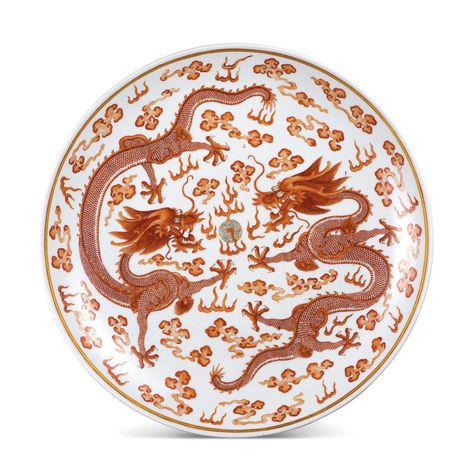 A LARGE IRON-RED DECORATED 'QIANQINGGONG' 'DRAGON' DISH MARK AND PERIOD OF GUANGXU deftly painted in tones of iron red with two dragons vying among clouds for a 'flaming pearl', the underside similarly painted with two dragons confronting each side of a stele inscribed with the three characters Qianqinggong, the base inscribed in iron red with a six-character reign mark Dragon Plate, Chinese Arts And Crafts, Three Characters, Dragon Designs, Dragon Shop, Catalog Request, Iron Red, 5 Elements, Chinese Vase