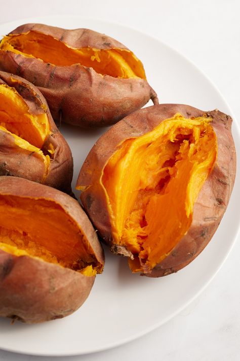 Four sweet potatoes on a white plate cut in half. Sweet Potato Recipes Microwave, Recipes Microwave, Microwave Sweet Potato, Sweet Potato Cheesecake, Sweet Potato Brownies, Cooking Sweet Potatoes, Vegan Sweet Potato, Potato Pie, Sweet Potato Pie