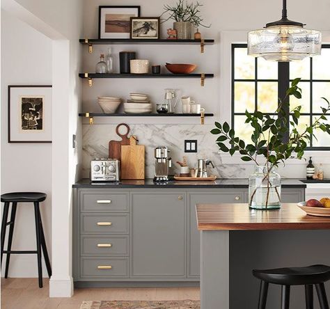 Loving this putty grey kitchen cabinet color paired with brass accents. The hardware is from Rejuvenation. The black floating shelves and wood island countertop make such a killer combo! Black Kitchen Countertops, Interior Vintage, Grey Kitchen Cabinets, Scandinavian Kitchen, Kitchen Cabinet Colors, Interior Modern, Bedroom Vintage, Grey Kitchen, Kitchen Redo