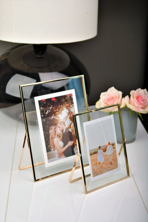 An elegant freestanding table picture frame with uv print on the glass. (names, hashtags, your brand). Also a perfect gift. Gold freestanding photo frame 20cm/8in (H) x 15cm/6in (W) x 1cm/0,5in (D) or 25cm/10in (H) x 20cm/8in (W) x 1cm/0,5in (D) Pack includes 1 frame without photo. Picture Frame Display On Table, Photo Frame On Table, Glass Frame Photo, Table Picture Frame, Photo Frame Table, Wedding Photo Table, Wedding Photo Frame, Small Photo Frames, Forest Essentials