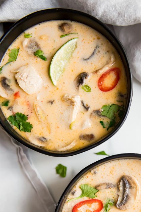 This Whole30 tom kha gai (or Whole30 Thai coconut soup) is absolutely perfect. Rich and creamy yet tangy and salty, this Whole30 tom kha gai is filling but light and positively bursting with flavor. The very best recipe I've ever made or tried, this Whole30 Thai coconut soup will be a favorite in your repertoire! #thai #soup Tom Kha Gai Soup, Tom Kha Soup, Coconut Chicken Soup, Soup Thai, Thai Coconut Chicken Soup, Thai Coconut Chicken, Thai Coconut Soup, Tom Kha Gai, Tom Kha