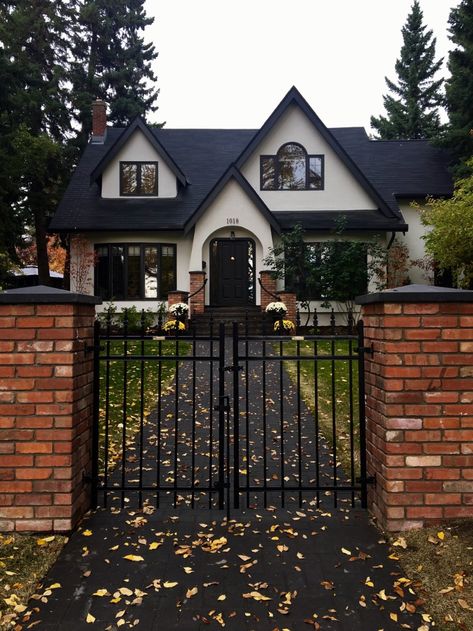 The Tudor style home Modern Home in Calgary, Alberta, Canada on Dwell Shingles Roof, Stucco Siding, Homes Exterior, Tudor Style Homes, Outdoor Living Design, House Property, Tudor House, Tudor Style, House Building