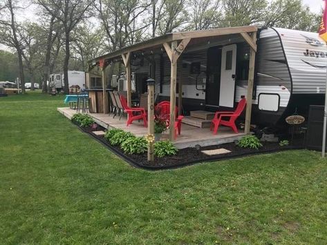 Outside Of Camper Ideas, Landscape Ideas Around Camper, Deck On Camper, Camp Porch Ideas, Camper Permanent Site, Diy Rv Patio Ideas, Seasonal Camping Sites Landscaping, Camper Lot Landscaping, Rv Porch Ideas