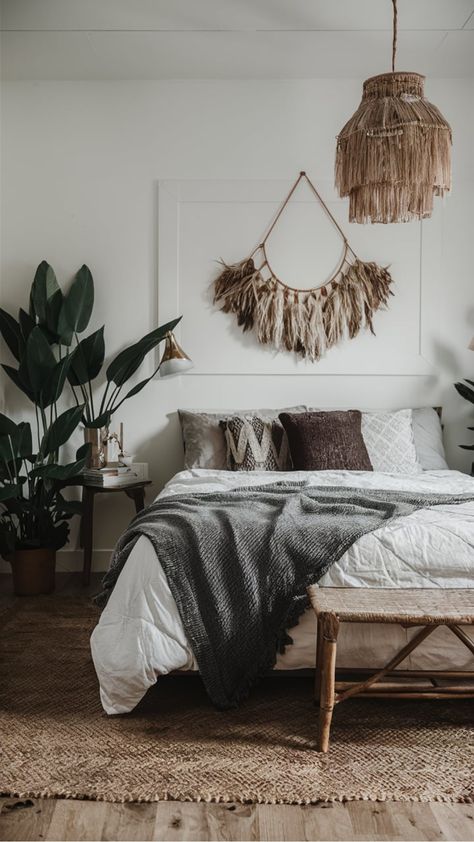 Bohemian-style bedroom with a white bed, hanging plants, and woven decor. Gray Boho Decor, Vintage Eclectic Bedroom, Modern Boho Interior, Cozy Boho Bedroom, Boho Bedrooms, Bohemian Bedroom Design, Masculine Bedroom, Macrame Wall Hangings, Eclectic Boho