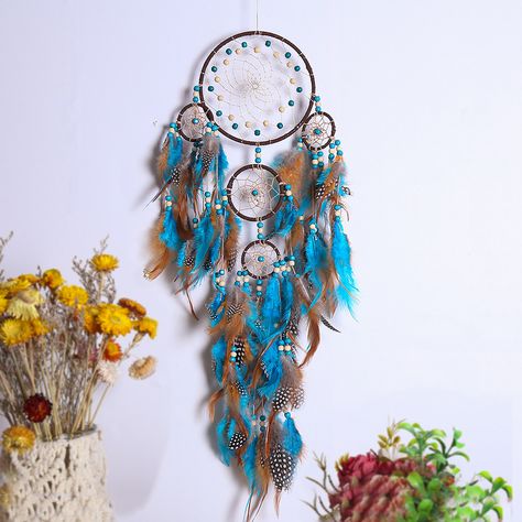 This Five Rings Dream Catcher Feather Pendant Dream Catcher is the perfect addition to any Scandinavian-style home. Made with real feathers, this wall decoration is both elegant and whimsical. The multiple rings and feathers create a stunning visual display, while the wind chime adds a relaxing touch to any room. The color as shown complements any neutral color scheme, making it a versatile piece for any decor style. Add this dream catcher feather pendant to your home for a touch of bohemian cha Wall Hanging Dream Catcher, Indian Dream Catcher, Blue Dream Catcher, Five Rings, Native American Decor, Feather Wall Hanging, Nice Dream, Large Dream Catcher, Feather Dream Catcher