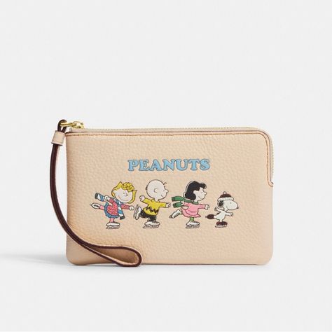 Coach X Peanuts Corner Zip Wristlet With Snoopy And Friends Motif Brand New With Tags 100% Authentic Color: Gold/Ivory Multi Product Details Refined Pebble Leather Two Credit Card Slots Zip-Top Closure, Fabric Lining Wrist Strap Attached 6 1/4" (L) X 4" (H) X 1/2" (W) This Special Coach X Peanuts Collaboration Combines Our Legacy Of Leathercraft With The Playful Attitude Of The Peanuts Crew 2022 Peanuts Worldwide Style No. Cf213 Price Is Firm Snoopy And Friends, The Peanuts, Envelope Wallet, Black Wristlet, Checkbook Cover, Wallet Pouch, Credit Card Wallet, Our Legacy, Change Purse