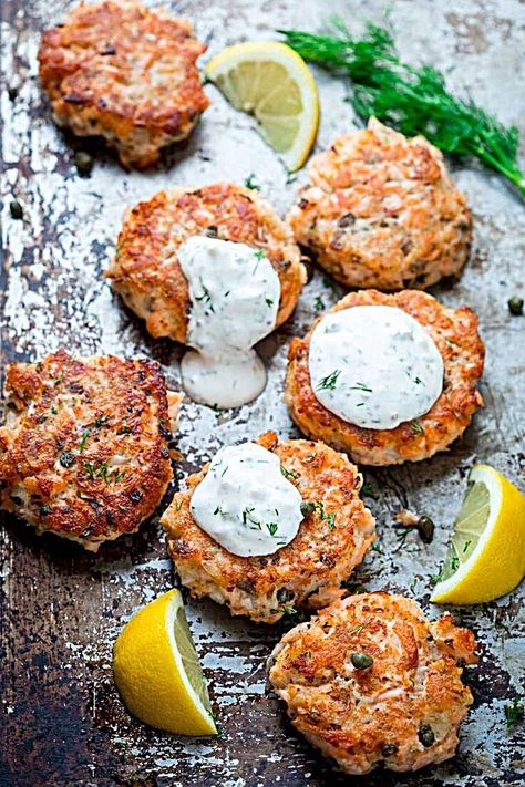 Turn leftover cooked salmon into elegant crispy salmon cakes with lemon zest, capers and light tartar sauce made with Greek yogurt. They're ready in less Lemon Caper Salmon, Cakes With Lemon, Lemon Caper Sauce, Caper Sauce, Fish Recipes Baked, Resep Seafood, Recipes Fish, Best Seafood Recipes, Salmon Cakes