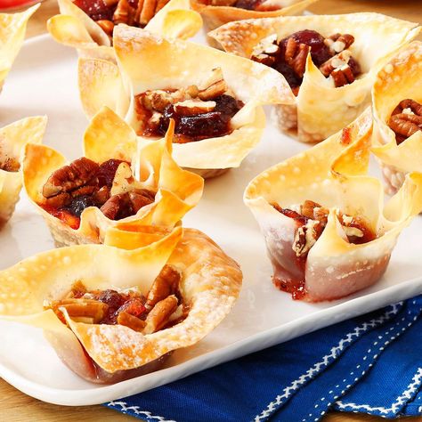 Cranberry-Pecan Brie Cups Recipe -These appetizer cups are great for entertaining since you can make them ahead of time and refrigerate until you're ready to pop them in the oven. Serve them hot out of the oven or at room temperature—your choice.—Trisha Kruse, Eagle, Idaho Wonton Ideas, Brie Cups, Pecan Brie, Wonton Wraps, Appetizer Cups, Wonton Wrapper Recipes, Peace Candle, Eagle Idaho, Wonton Cups