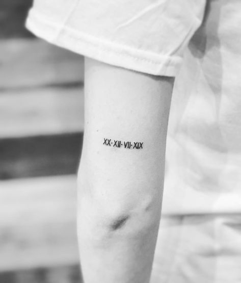 Best Roman Numeral Tattoo Ideas | POPSUGAR Beauty Photo 26 Fineline Roman Numeral Tattoo, Tattoo On Back Of Arm, Roman Numeral Tattoo Ideas, Numeral Tattoo Ideas, Tiny Tattoos With Meaning, Design Tatuaje, Faith Tattoo On Wrist, Coordinates Tattoo, Inner Arm Tattoos