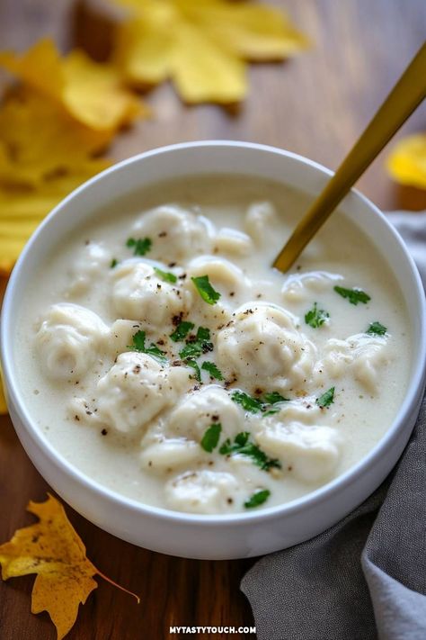 Dive into my delicious and comforting creamy dumpling soup! This recipe combines fluffy dumplings in a rich, velvety broth, perfect for chilly days. I love garnishing it with fresh parsley for an extra burst of flavor. Perfect for warming up on a cold evening! Creamy Dumpling Soup, Fluffy Dumplings, Vegan Dumplings, Soup Dumplings, Dumpling Soup, How To Make Dumplings, Dumpling Filling, Chinese Dumplings, Culinary Techniques