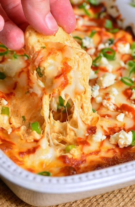 Buffalo Chicken Dip recipe for a perfect party dip made with chicken meat cooked in buffalo wing sauce, cream cheese, Monterrey Jack cheese, and Blue cheese crumbles. #dip #chickendip #appetizer #partyfood #buffalochicken Blue Cheese Crumbles, Buffalo Dip, Buffalo Chicken Dip Recipe, Buffalo Wing, Party Dip, Buffalo Wing Sauce, Football Snacks, Taco Dip, Chicken Dip