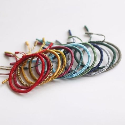 Tibetan Buddhist String Bracelets are an up and coming trend recently. You may have seen the many celebrities wearing them, or heard about them from a friend, but the roots of the Buddhist knot bracelet are ancient and their significance is still felt in Eastern cultures. Here are 5 Reasons Why You Should Wear Tibetan Buddhist String Bracelets 1. The Creation Process Traditionally, they are handmade and each one takes somewhere between 1 and 3 days. The Buddhist artisans recite a mantra and b Chakra Meanings, Knot Bracelets, Hand Mudras, Protective Charms, Buddhist Bracelet, Tibetan Bracelet, Bracelets With Meaning, Red String Bracelet, Seven Chakras