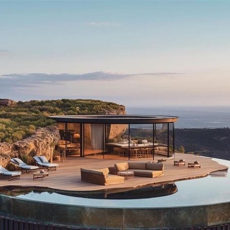 ArchGalaxy on Instagram: "The Coin and the Cliff AI aided concept design by @studio7.83 A somewhat exaggerated design for a dream villa inspired by the shape of a 10c coin embedded harmoniously into the cliffs of Ibiza. #midjourney #diseno #dreamhouse #housesaddictive #diseño #wabisabi #sustainablearchitecture #aidesign #architecturephotography #coin #luxuryhomes #midjourneyarchitecture #designmidjourney #architecture_hunter #architectanddesign #architexture #livingroom #vogueliving #modern Earth Dome, Brunch London, London Breakfast, Dream Villa, Cliff House, Ibiza Spain, The Cliff, London Restaurants, Island Home