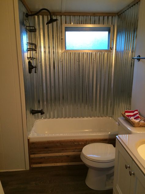 Trailer bathroom redo Old Bathroom Shower Makeover, Tin Wall Bathroom, Rustic Single Wide Mobile Home, Bathroom Remodel Trailer Mobile Homes, Trailer Home Remodel Double Wide, Rustic Trailer Remodel, Trailer House Bathroom Remodel, Trailer Remodel Single Wide Diy Bathroom, Tin Shower Walls Rustic Bathrooms