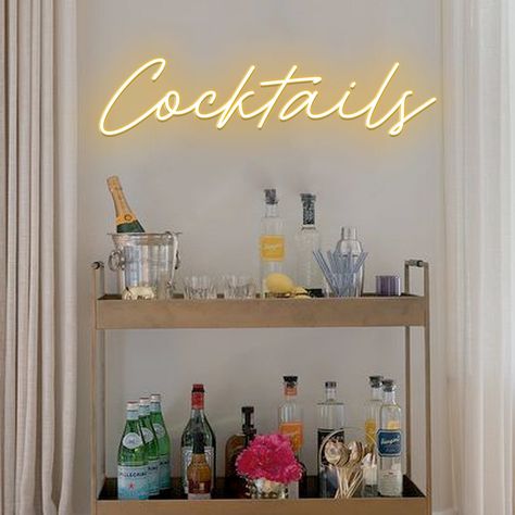 "Cocktails" LED neon sign for bar cart wall decor, party or any other space where you enjoy your favourite drinks! D E T A I L S * High-quality LED neon sign. * Transparent acrylic backboard with holes for hanging. * 7 feet (2m) transparent wire from sign to power adaptor (we can lengthen by request). What else it comes with? * Dimmer remote controller. * 3 feet power adaptor cord with a plug of your country. * Good vibes (read further) I T ' S * A W E S O M E * We use LED neon for our signs whi Kitchen With Neon Sign, Neon Signs Living Room Decor, Led Bar Sign, Cocktail Neon Sign, Cute Neon Signs, Cute Bar Cart, Bar Cart Aesthetic, Girly Bar Cart, Aesthetic Bar Cart