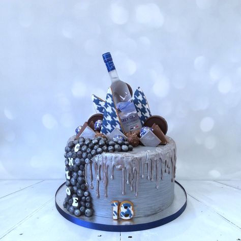 Silver Drip Cake - decorated with gingerbread biscuits, “Grey Goose” vodka, fresh blueberries and favorite chocolates. Silver Drip Cake, Gingerbread Biscuits, Grey Goose Vodka, Grey Goose, Drip Cake, Drip Cakes, Blueberries, Chocolates, Vodka